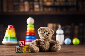 Teddy bear on on vintage wooden background