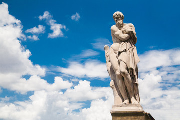 Fototapeta premium Ponte Santa Trinita Winter statue by in Florence, Italy
