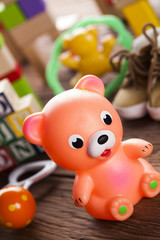 Fototapeta na wymiar Colorful children toys on wooden background