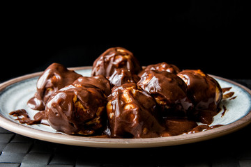 Profiteroles with chocolate cream.