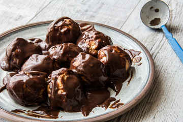 Profiteroles with chocolate cream.