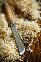 Woodworking tools. Chisel with sawdust .