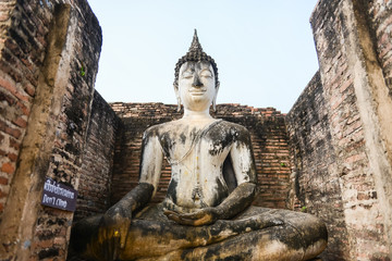 Old buddha in the temple at Sukhothai Historical Park in Sukhothai Province, Thailand