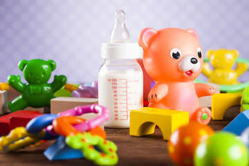 Children's of toy accessories on wooden background
