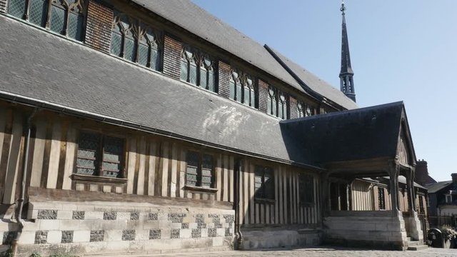 Wooden Saint Catherines church surroundings and exterior by the day of famous landmark in French Normandie 