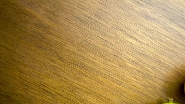 Freshly harvested gourmet miniature pear fruit with copyspace before and after aerial panning motion