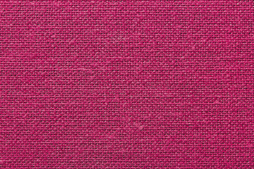 Pink burlap canvas closeup background.