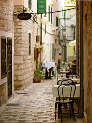 Fototapeta na wymiar The old ancient street cafe in Šibenik, south Croatia