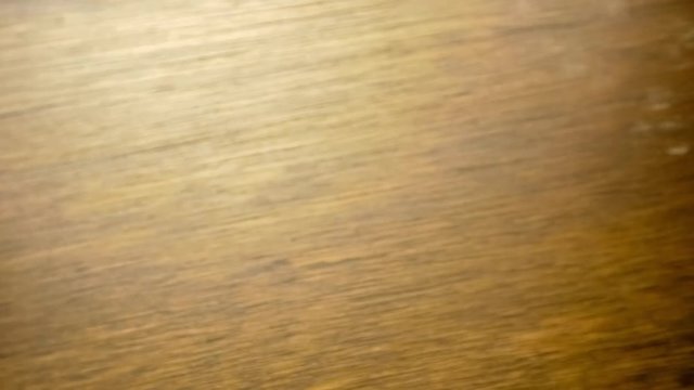 Panning aerial macro of ripe paradise pear fruits with stems in round bowl