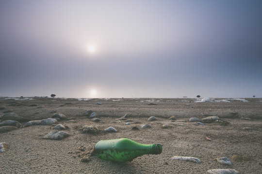 Flaska p&aring; en strand