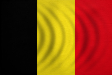 Fototapeta premium Flaga Belgii falowana, prawdziwa szczegółowa tekstura tkaniny