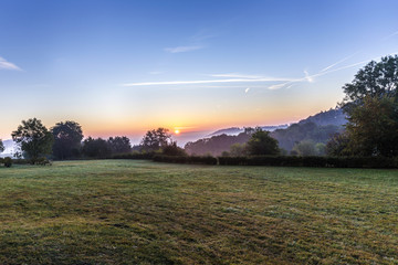 sunrise in german countryside with hills in the Eifel