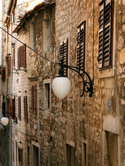The typical house walls in Croatia. The cosy street in Croatia in šibenik
