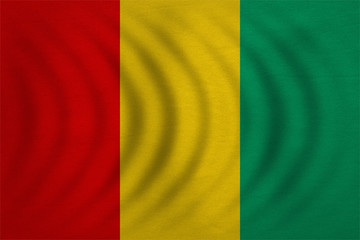 Flag of Guinea wavy, real detailed fabric texture