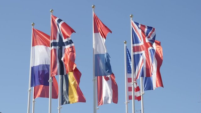 Silky fabrics of different nation symbols on wind 4K 2160p 30fps UltraHD footage - Different flags mixed with American and Canadian 3840X2160 UHD video 