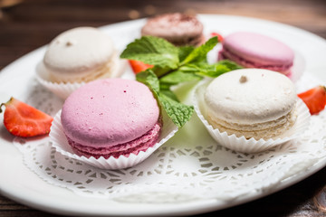 Several macaroons on a white plate