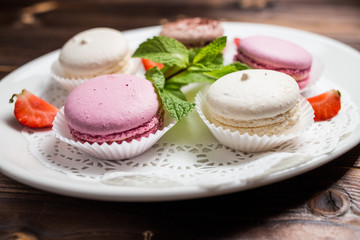 Several macaroons on a white plate
