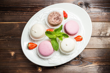 Several macaroons on a white plate