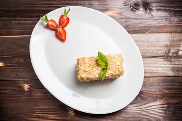 Napoleon cake on white plate