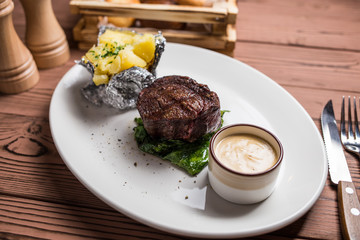 Grilled steaks and baked potatoes