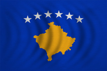 Flag of Kosovo wavy, real detailed fabric texture
