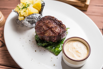 Grilled steaks and baked potatoes