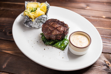 Grilled steaks and baked potatoes
