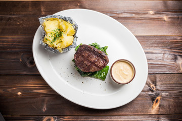 Grilled steaks and baked potatoes