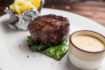 Grilled steaks and baked potatoes