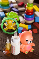 Pile of toys, collection on wooden background