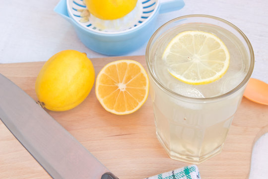 Lemonade in glass with fresh lemon