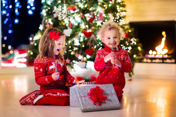 Kids under Christmas tree