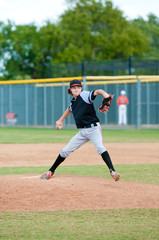American teen baseball player pitching