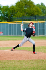Youth baseball pitcher throwing