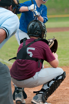 Youth baseball catcher and umpire