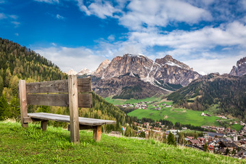 Small wooden bench in Dolomites, Alps, Italy