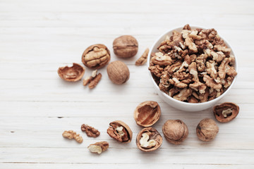 walnuts on white wooden background