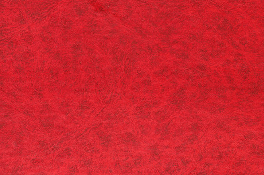 Red color leather surface.