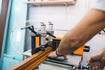 Manual worker assembling PVC doors and windows. Manufacturing jobs. Selective focus. Factory for aluminum and PVC windows and doors production.