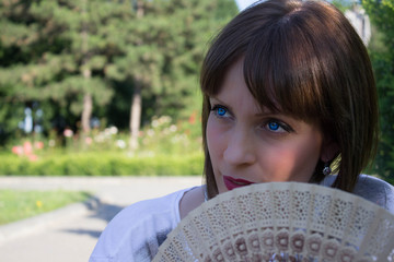beautiful blue-eyed girl in the park