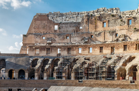 The Colosseum, an architectural monument in Rome, view from the inside, fragment of the wall with scaffolding