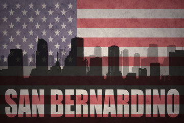 abstract silhouette of the city with text San Bernardino at the vintage american flag