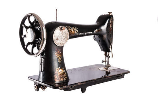 The old sewing machine on a white background