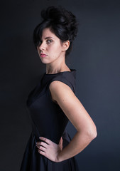 photo dark haired model in black dress with a high hairdo