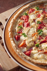 Tart with salted sheep cheese and tomatoes