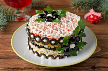 Salad with crab sticks, cheese, egg and prunes