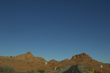 Landscape image of the highway winding and twisting through the Valley of Fire State Park outside of Las Vegas, Nevada.