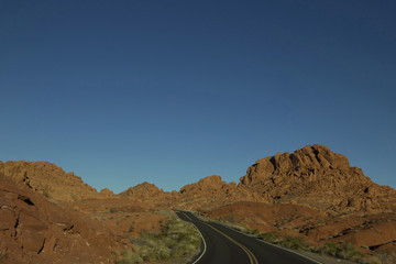 Landscape image of the highway winding and twisting through the Valley of Fire State Park outside of Las Vegas, Nevada.