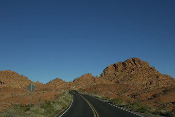 Landscape image of the highway winding and twisting through the Valley of Fire State Park outside of Las Vegas, Nevada.