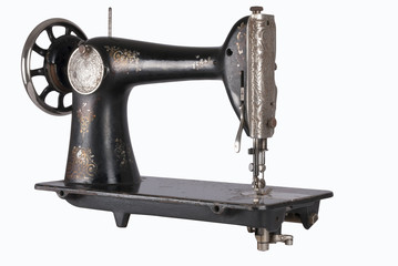 The old sewing machine on a white background